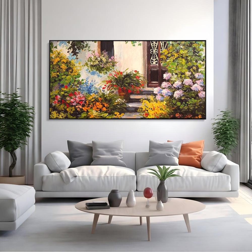 Tablou canvas cu tablou canvas cu alee florala si casa, in rama de aluminiu negru, pe perete intr-un living